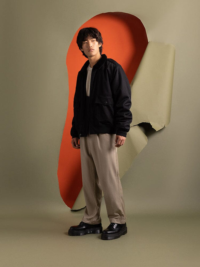 Side-view of a person wearing an 1940s B-10 Bomber Jacket by Alpha Industries.