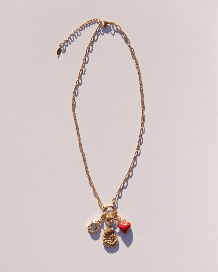 Gold plated chain link necklace with a range of charms attached