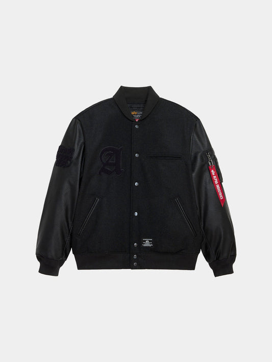 Alpha Industries Alpha Letterman Jacket in black with wool blend body, faux leather sleeves, snap buttons, chest pocket, embroidered large A patch, red zipper tag on right sleeve.