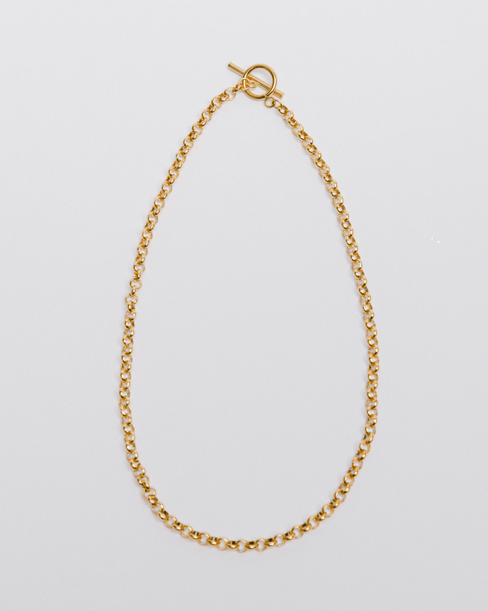 A chunky gold toggle necklace with a classic chain design, displayed against a white background.