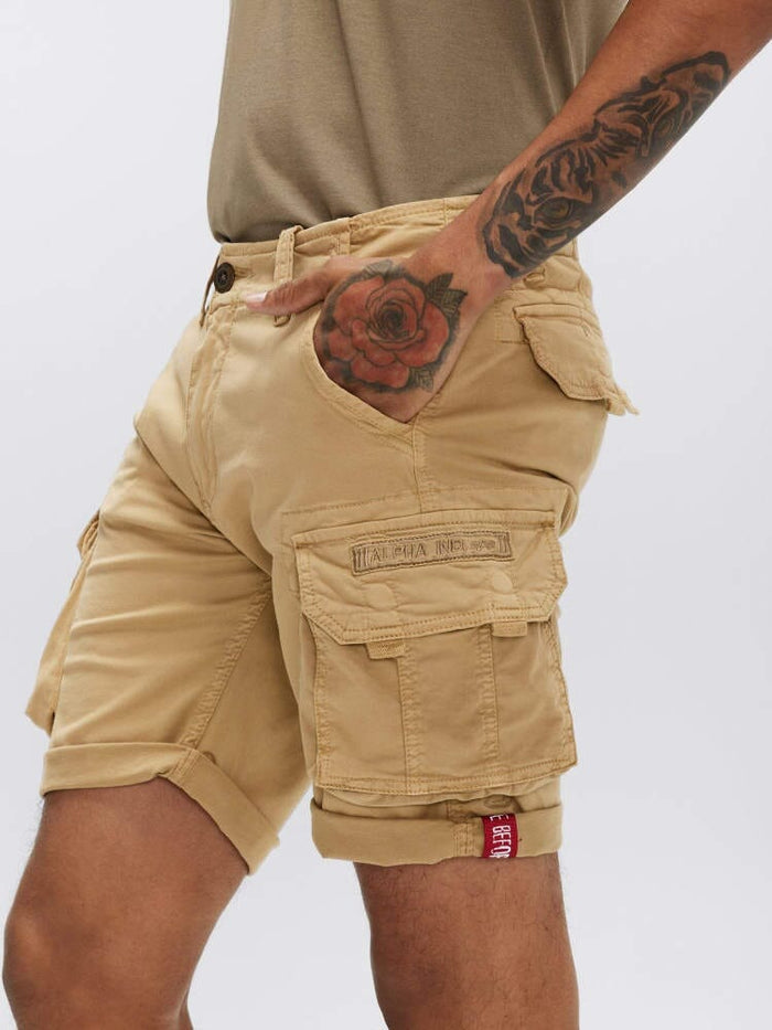 Alpha Industries Crew Short Gen I tan cotton cargo shorts with multiple pockets and red tag.