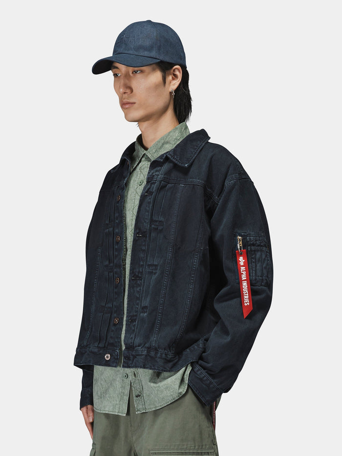 CTN Work Overshirt in green by Alpha Industries, green cargo pants, blue denim jacket with red sleeve tag, blue cap.