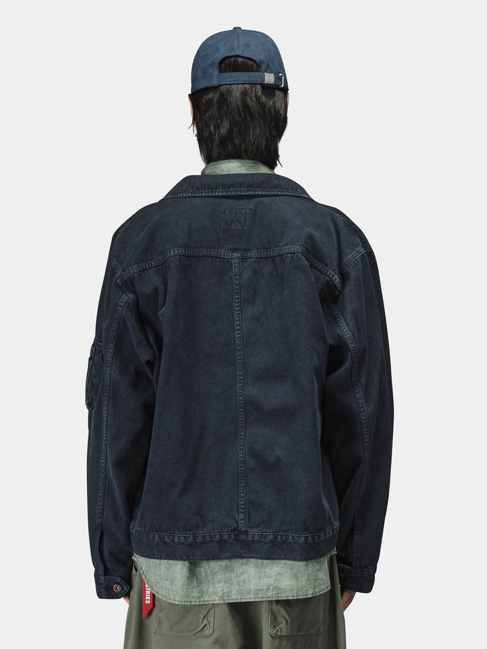 Alpha Industries Ctn Work Overshirt in dark denim with green shirt and blue cap.