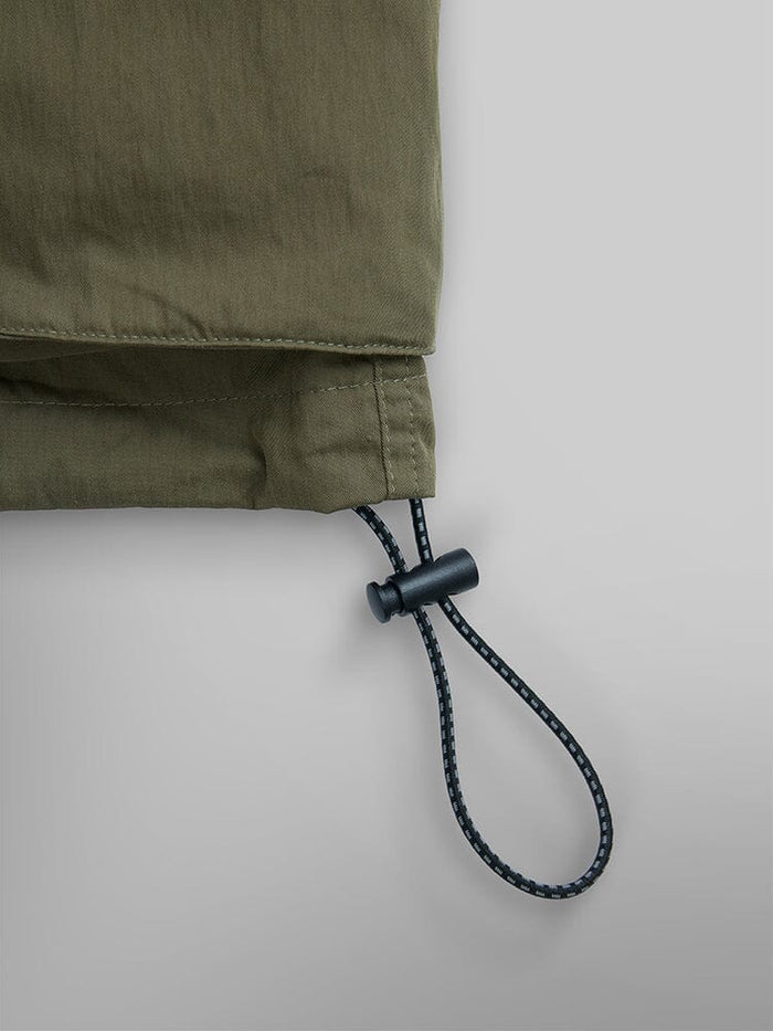 Alpha Industries Cwu 36/P Pull On Short, olive green, black drawstring with plastic toggle, elastic waistband.