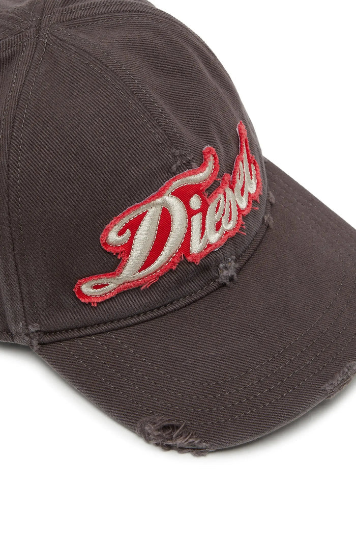 Distressed baseball cap with embroidered patch
