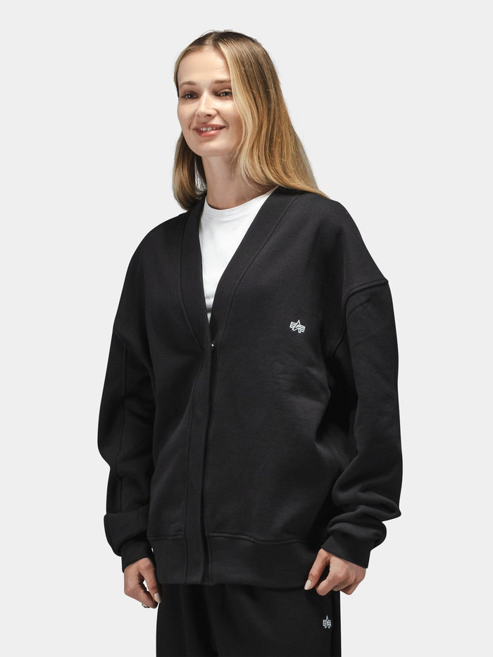 Alpha Industries Essential Cardigan in cotton-poly blend, black, worn over white t-shirt and black pants.