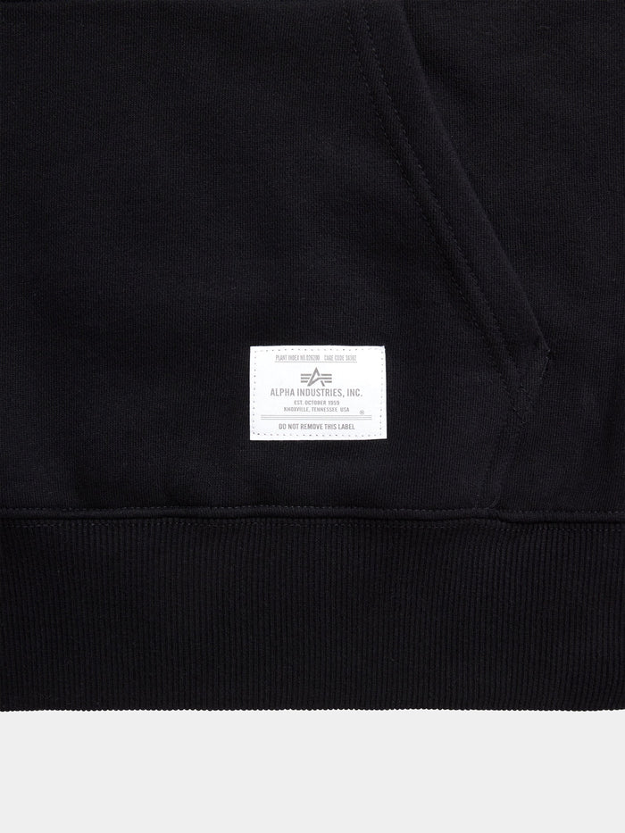 Black Alpha Industries Essential Hoodie with kangaroo pocket and white Alpha Industries label near the hem.
