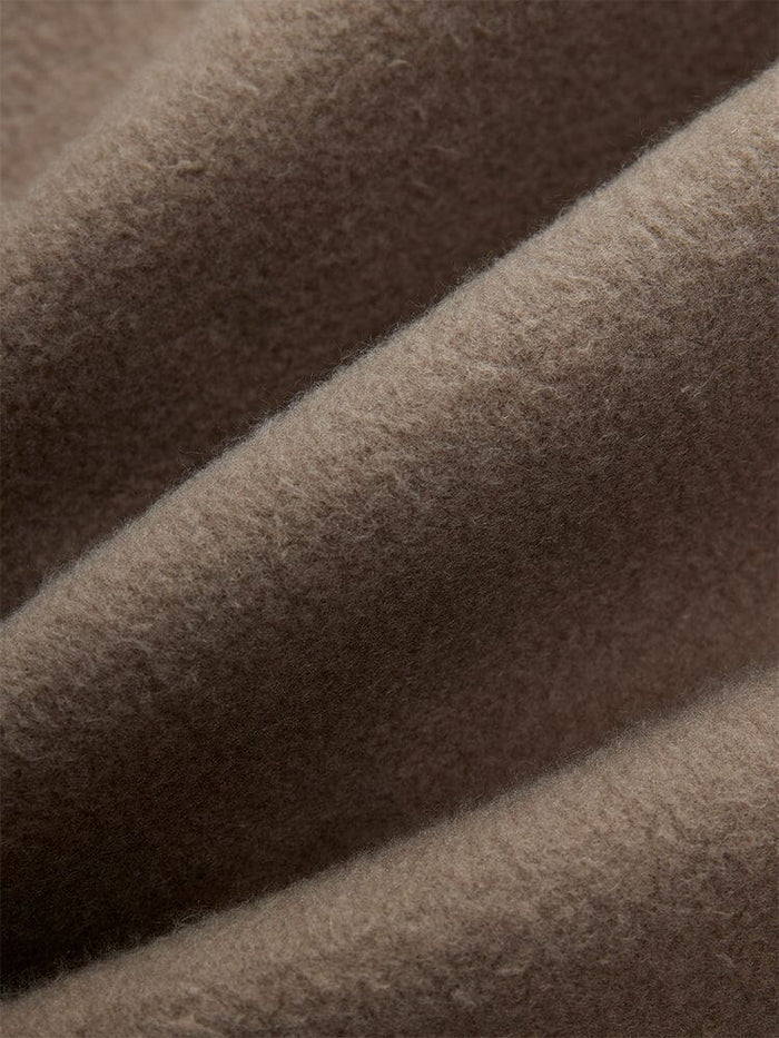Alpha Industries Essential Sweatpants, Coyote Brown fabric with visible fibers and elastic waistband.