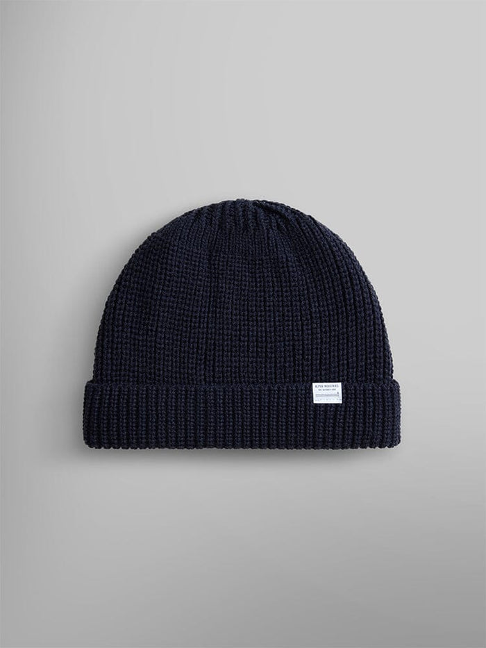 Introducing the Essential Watch Cap from Alpha Industries, in a stunning Replica Blue wool-blend. This classic knitted beanie showcases a small white label on the cuff.