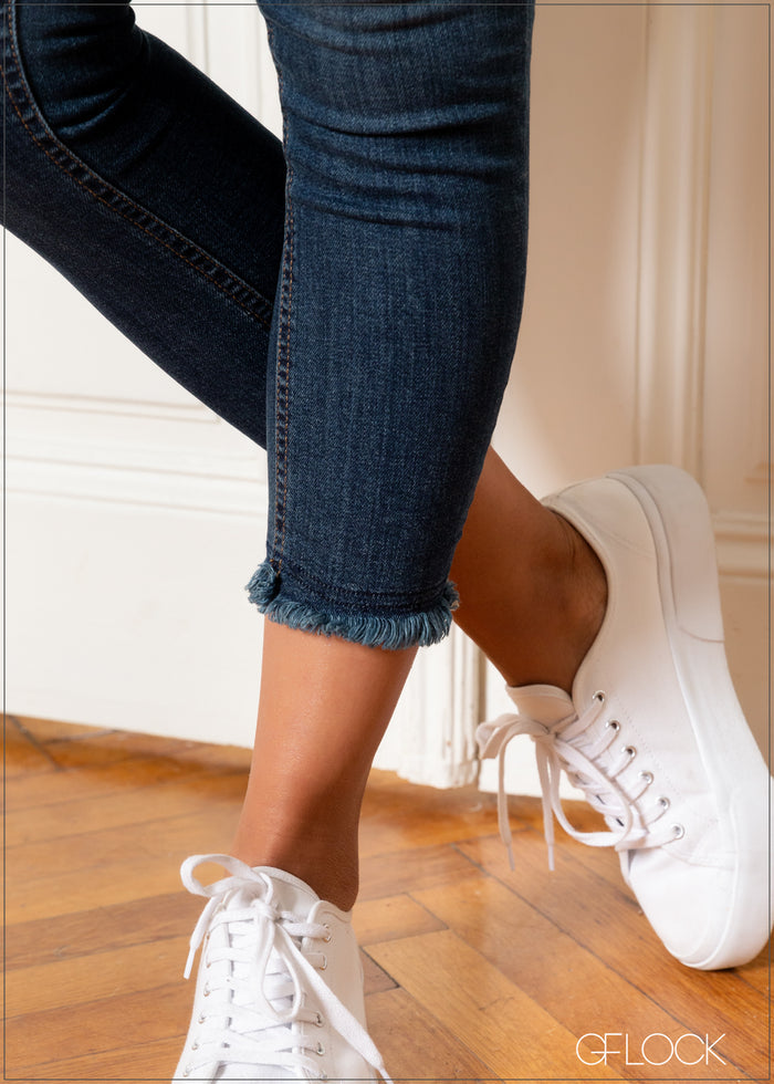 Four Quarter Mid Wash Jean