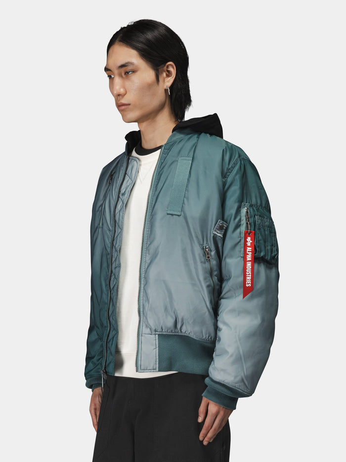 Alpha Industries Gradient Washed Flight Jacket in teal with red Remove Before Flight sleeve tag.