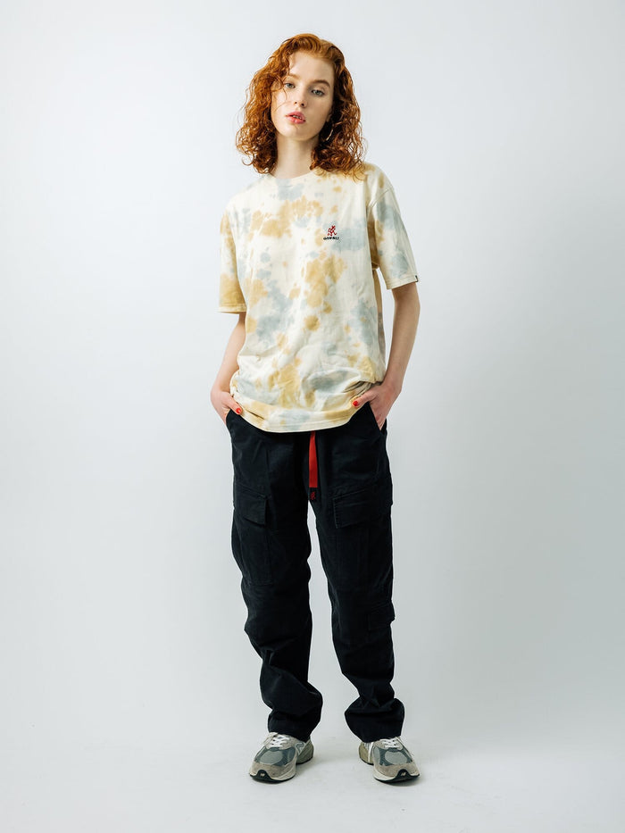 Gramicci X Alpha Cotton Camo Tie Dye Tee by Alpha Industries, black cargo pants with Gramicci logo, gray sneakers.