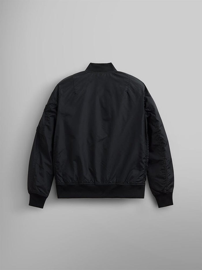 The L-2B Skymaster Gen II Bomber Jacket W by Alpha Industries, Inc. is a black bomber jacket made from lightweight nylon. It features a minimalist design with discreet oxygen tab details. This water-resistant jacket offers an elegant blend of style and functionality.