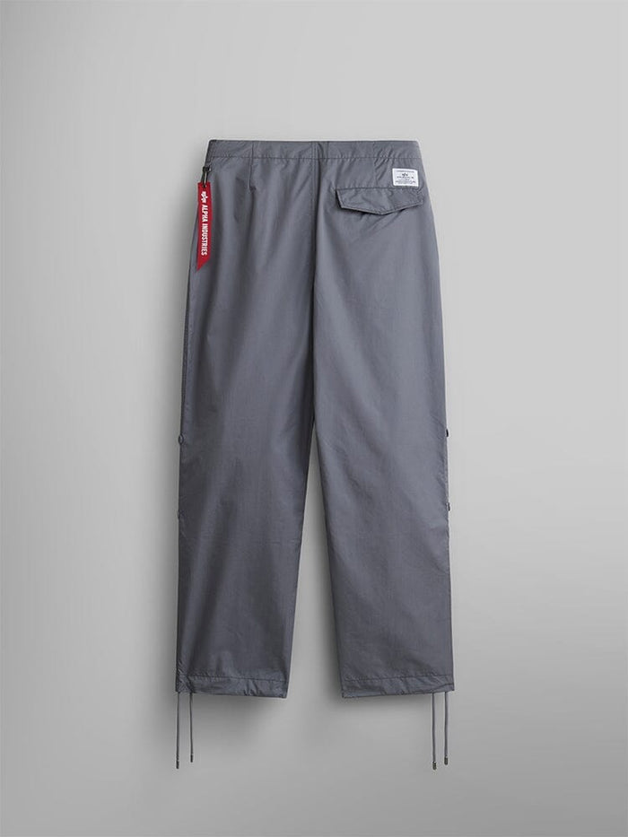 Alpha Industries Lightweight Parachute Pant, Aircraft Gray, nylon/cotton blend, straight-leg fit, drawstring hem, back pocket with white label, red fabric keychain on waistband.