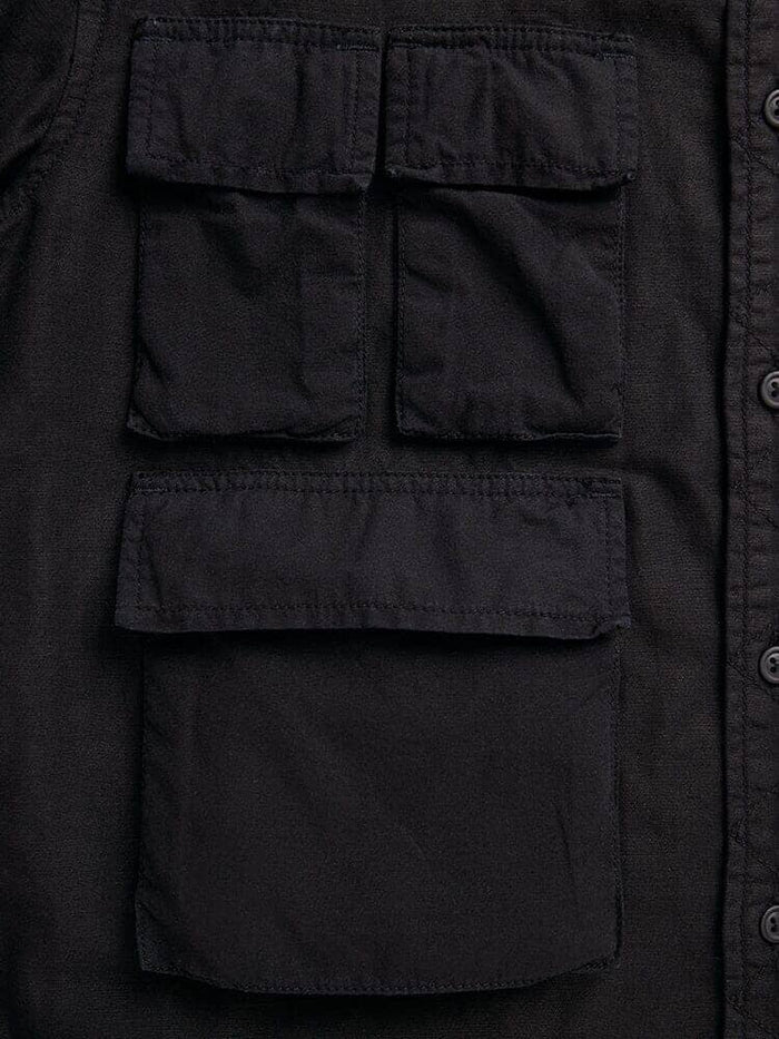 Alpha Industries Long Sleeve Multi Pocket Shirt, black, rectangular front flap pockets—two small above a larger pocket, button closure down right edge.