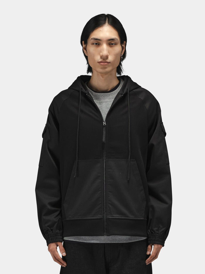 Alpha Industries M-65 Zip Up Hoodie, cotton-poly blend, front pockets, gray shirt underneath.