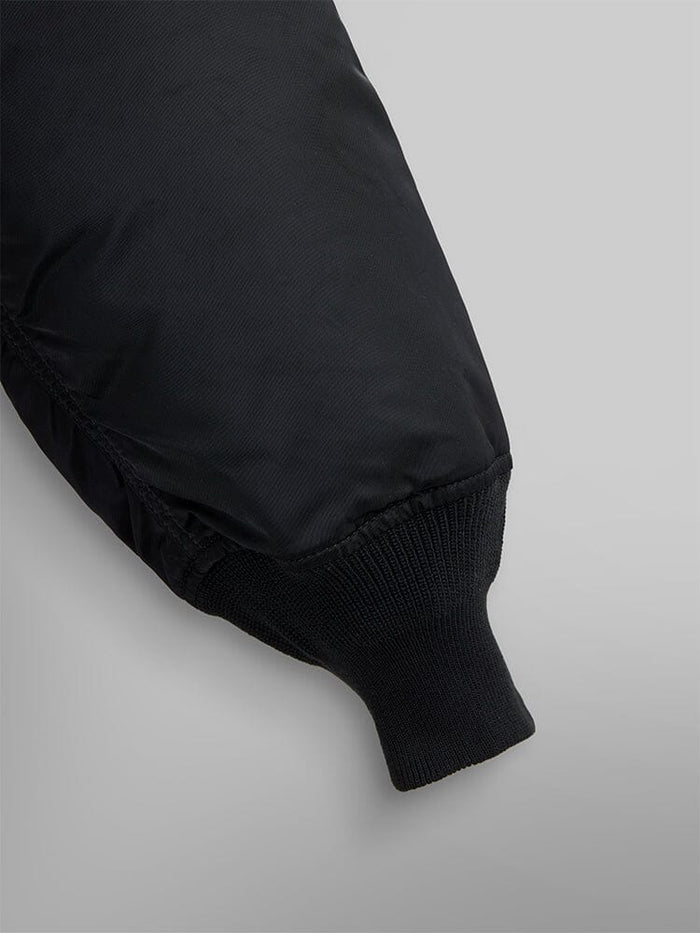 MA-1 Bomber Jacket by Alpha Industries with black flight nylon sleeve and ribbed knit cuff.