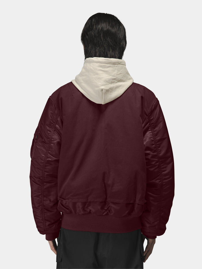 Alpha Industries MA-1 Mixed Cotton Flight Jacket in burgundy over a light beige hoodie.