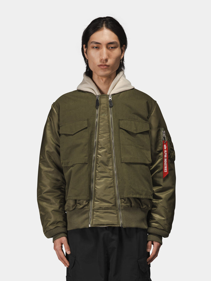 Alpha Industries MA-1 Mixed Cotton Flight Jacket in olive green with large front pockets and a beige hood.