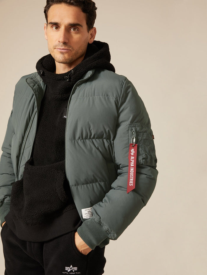 Alpha Industries MA-1 Quilted Bomber Jacket in Green, Water-Resistant with Red Remove Before Flight Sleeve Tag.