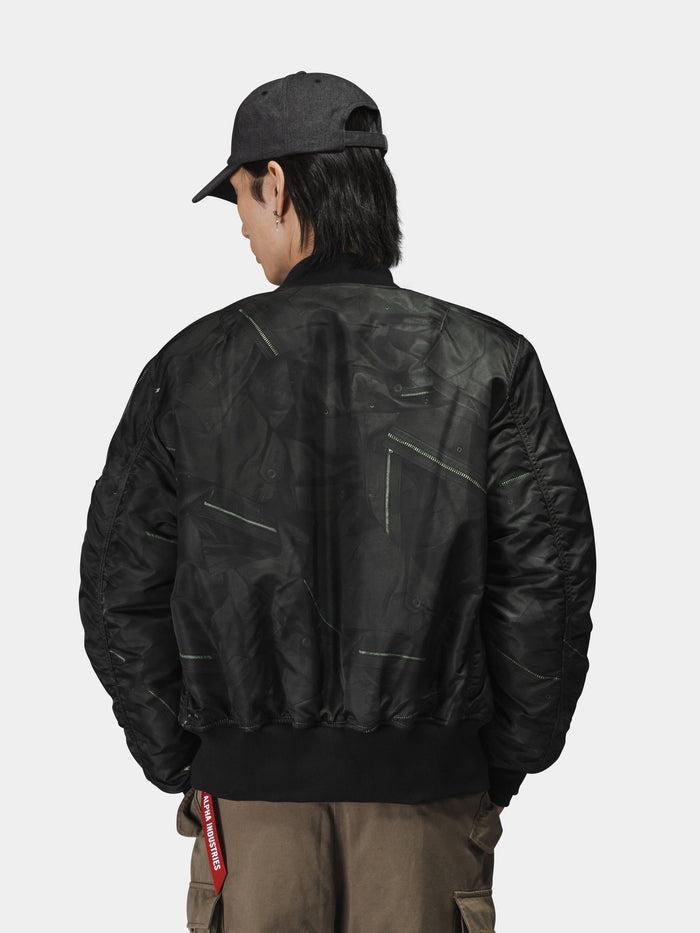 Alpha Industries MA-1 Zippered Print Flight Jacket with zippered front, khaki pants, and black cap.