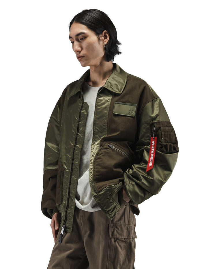 Alpha Industries Mixed Media CWU 36P Mod Jacket, two-tone olive green flight jacket with zip pocket, red tag, and zipper closure.