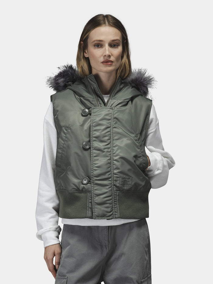 Alpha Industries N-2b Vest Womens with faux fur hood, white sweatshirt, gray cargo pants.