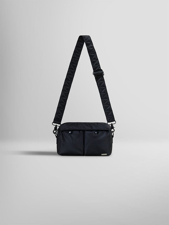 The Black Nylon Messenger Bag by Alpha Industries boasts a quilted adjustable shoulder strap and two front pockets.
