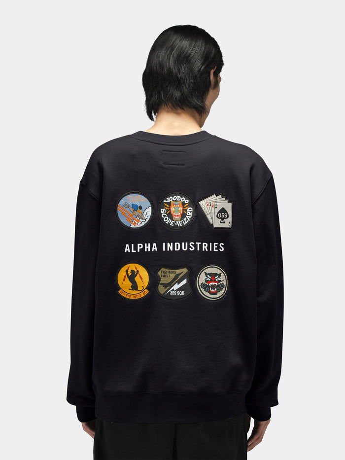 Alpha Industries Patched Crewneck, black cotton-poly sweatshirt with six embroidered patches and Alpha Industries logo on back.