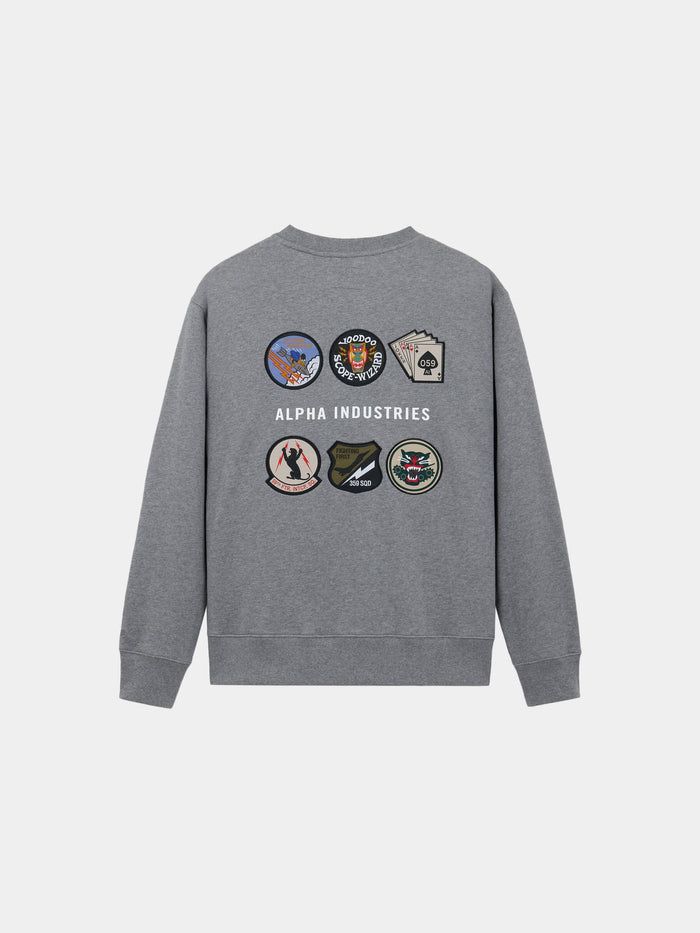 Alpha Industries Patched Crewneck in Medium Charcoal Heather, cotton-poly blend, with Alpha Industries text and seven embroidered back patches.
