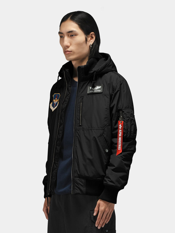 Alpha Industries Patched Hooded Rib Flight Jacket, black bomber with military-inspired patches and red sleeve tag.