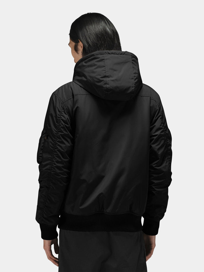 Alpha Industries Patched Hooded Rib Flight Jacket with patched design, ribbed cuffs and hem, and hood.