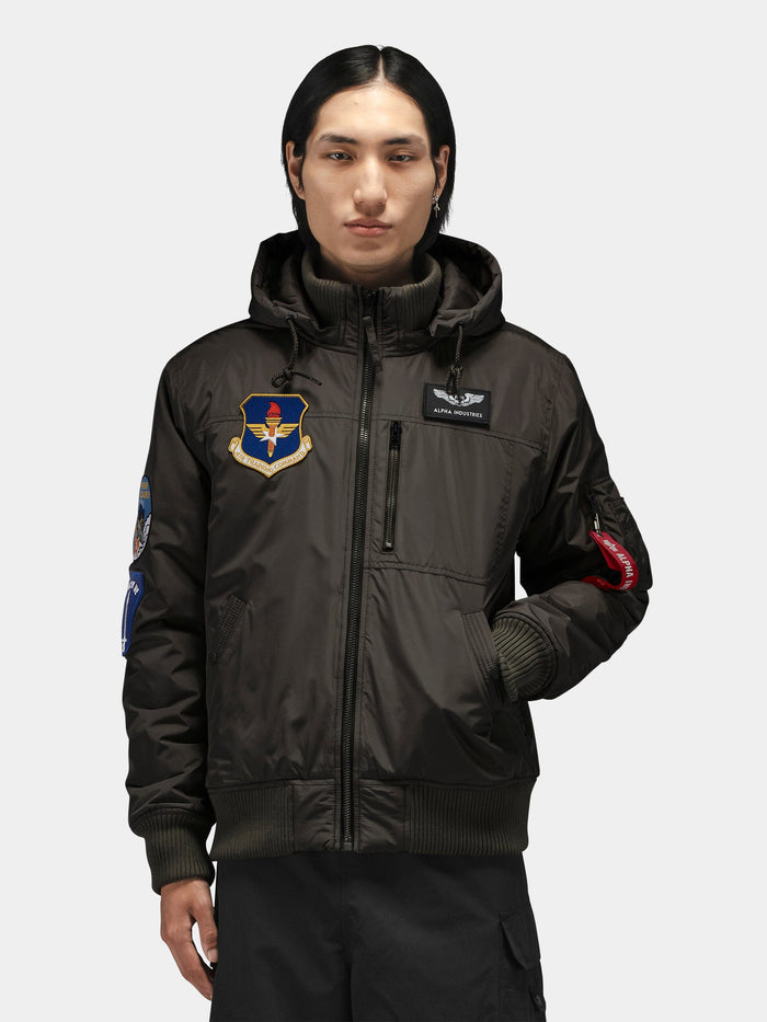 Alpha Industries Patched Hooded Rib Flight Jacket with military-inspired patches and a utility pocket.