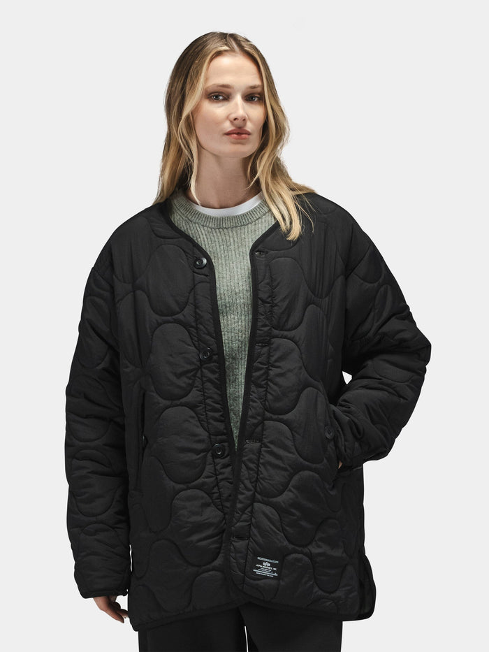 Alpha Industries Reversible Als/92 Mod Liner Womens, light green sweater with black nylon ripstop quilted jacket.