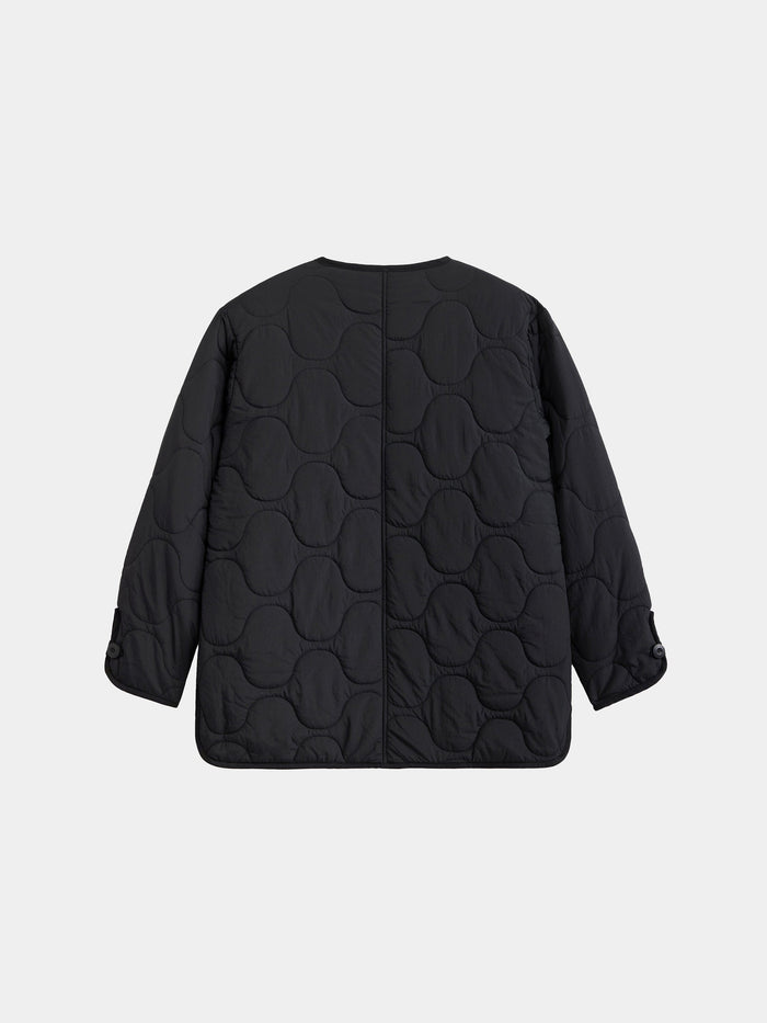 Alpha Industries Reversible Als/92 Mod Liner Womens black quilted nylon ripstop jacket with circular stitching, long sleeves, buttoned cuffs.
