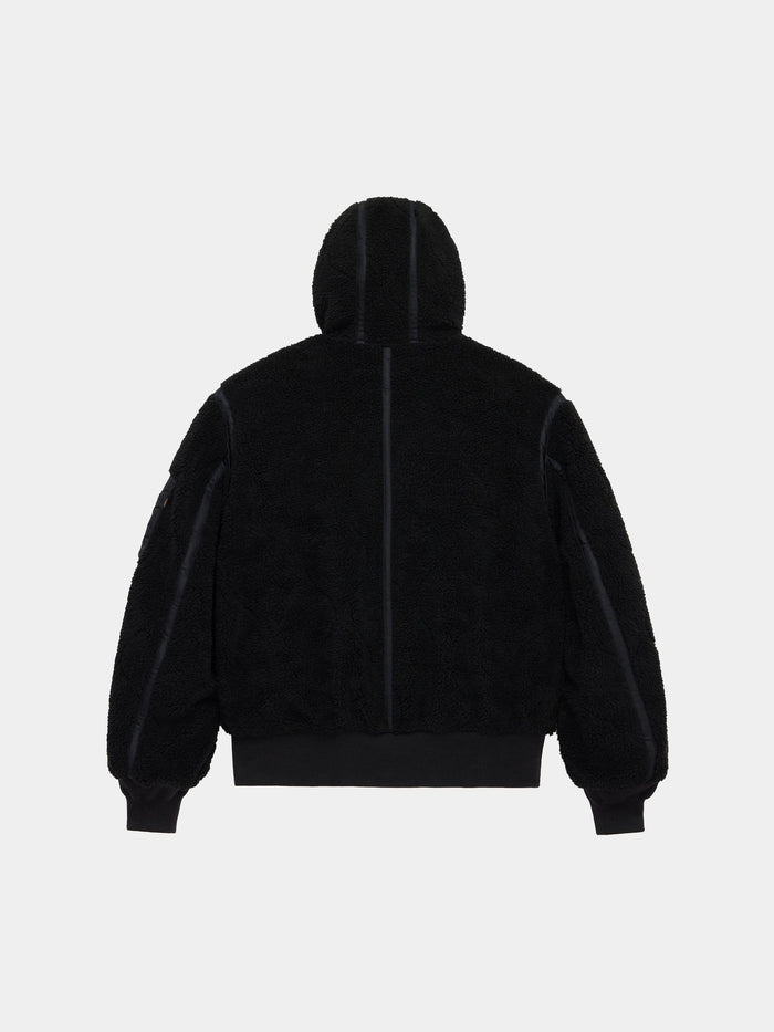 Alpha Industries Sherpa Onion Quilting Flight Jacket with black sherpa quilting, ribbed cuffs, and waistband.