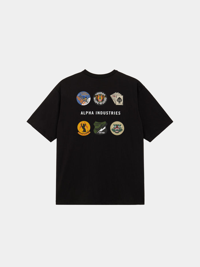 The Alpha Industries Short Sleeve Patched Tee in Black with six military-inspired patches and Alpha Industries branding on the back.