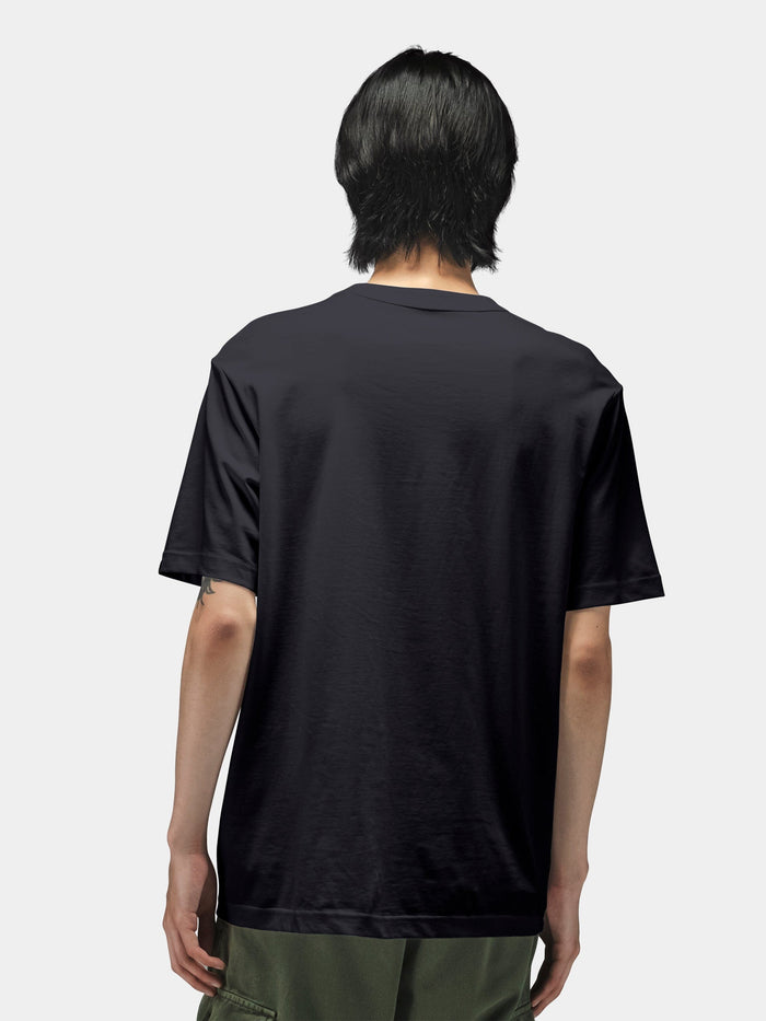 Alpha Industries Short Sleeve Regular Tee in black, green pants.