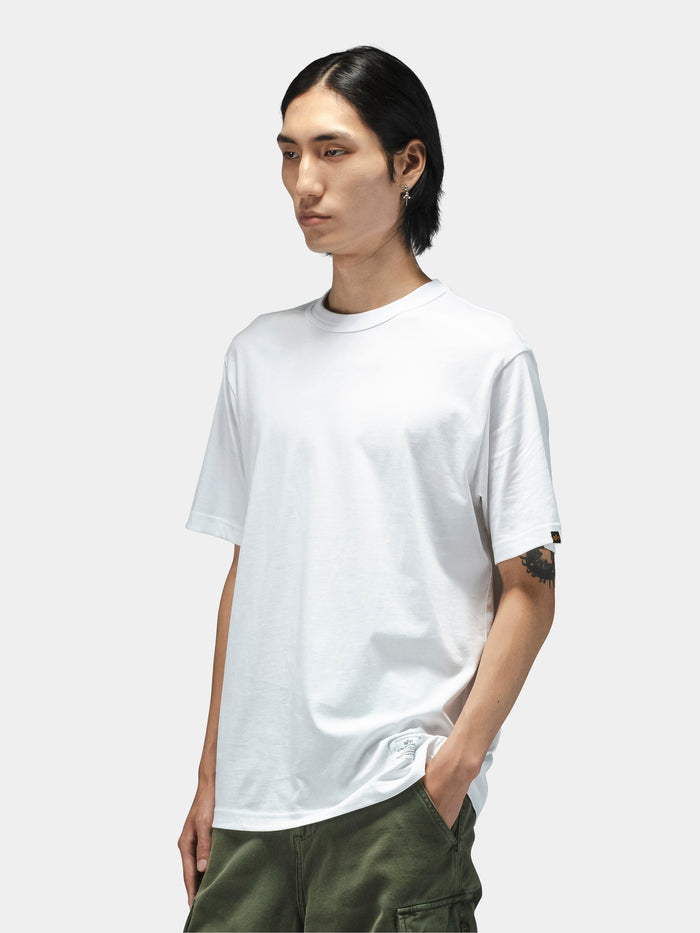 Alpha Industries Short Sleeve Regular Tee in black, paired with green pants.