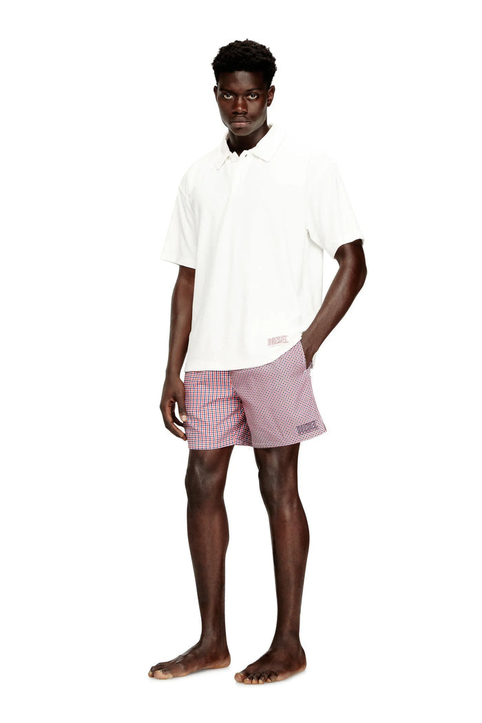 Swim shorts with mixed patterns