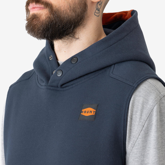 Front of button snaps of the BRUNT sleeveless water resistant workwear hoodie in [x] with BRUNT high quality long sleeve pocket tee in light grey underneath