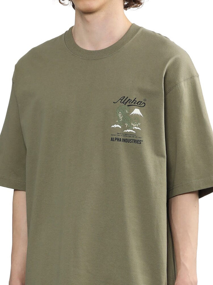 Alpha Industries Unfrm Tiger Short Sleeve Tee, olive green, mountain and tree graphic on chest.
