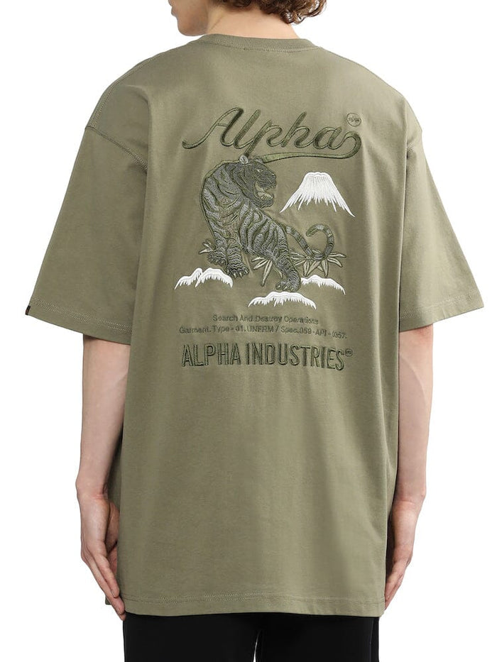 Alpha Industries Unfrm Tiger Short Sleeve Tee in olive green, with tiger and Mount Fuji back graphic, embroidered text, and Alpha branding.