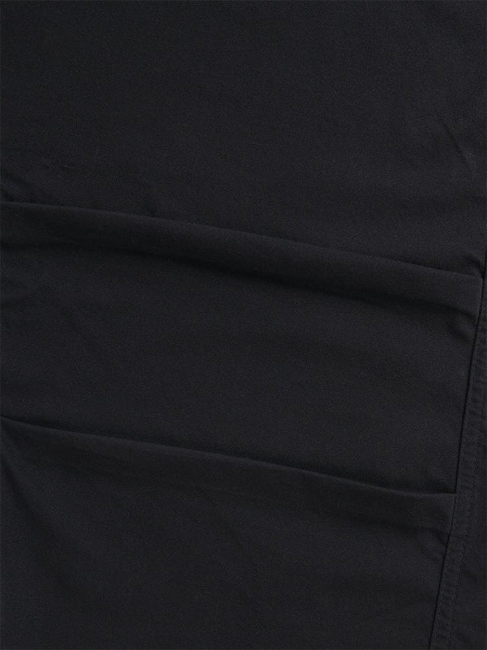 A close-up of the Women's Barrel Leg Pants in black by Alpha Industries highlights the fabric's seams and stitching, radiating the detailed craftsmanship reminiscent of high-waisted pants.