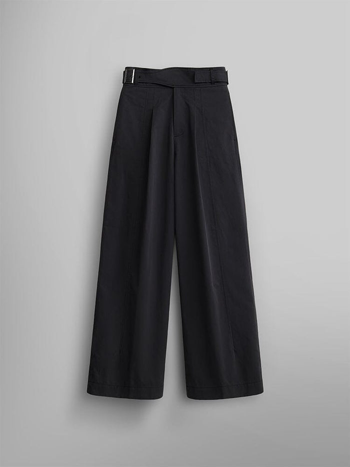 The Women's Gurkha Wide Leg Trouser in black by Alpha Industries features a high-waisted design with a wide-leg silhouette and pleated front.