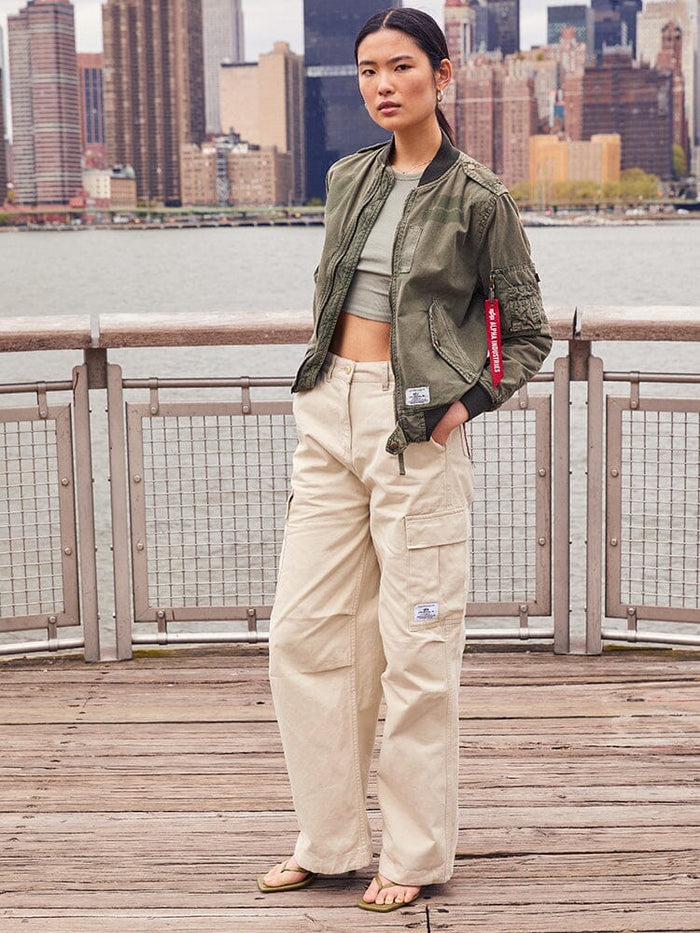 Alpha Industries Womens M-65 Cargo Pant Limestone, green bomber jacket, cropped top, sandals.