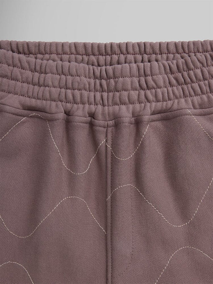 Alpha Industries Womens Quilted Shorts, mauve terry fleece, elastic waistband, decorative wavy stitching.